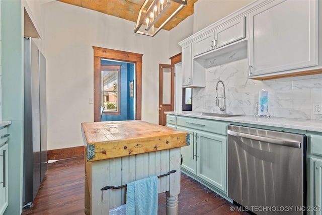121 F SW, Ardmore, OK 73401 - kitchen featuring dishwasher, dark wood-style flooring, tasteful backsplash, and butcher block counters