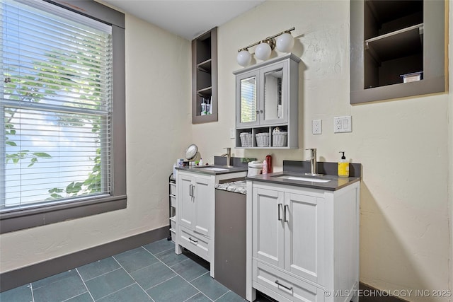 121 F SW, Ardmore, OK 73401 - full bath with two vanities and tile patterned floors