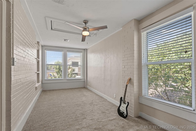 121 F SW, Ardmore, OK 73401 - spare room featuring healthy amount of natural light, carpet, and ceiling fan