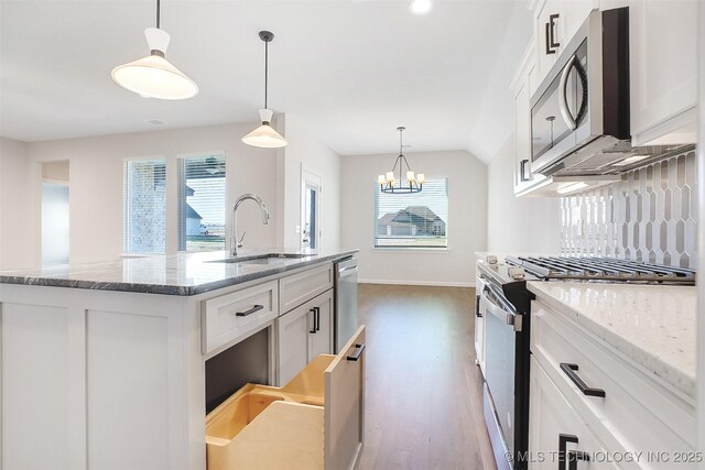 23192 E 106th St S, Broken Arrow, OK 74014 - kitchen featuring white cabinetry, a sink, appliances with stainless steel finishes, and a wealth of natural light