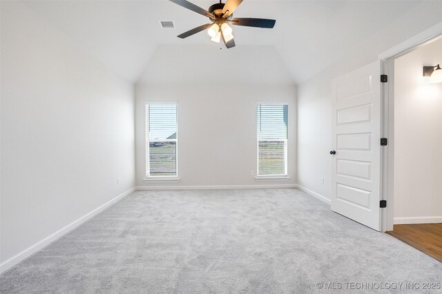 23192 E 106th St S, Broken Arrow, OK 74014 - carpeted empty room with baseboards, lofted ceiling, visible vents, and a ceiling fan
