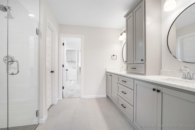23192 E 106th St S, Broken Arrow, OK 74014 - full bath with double vanity, a sink, and a stall shower