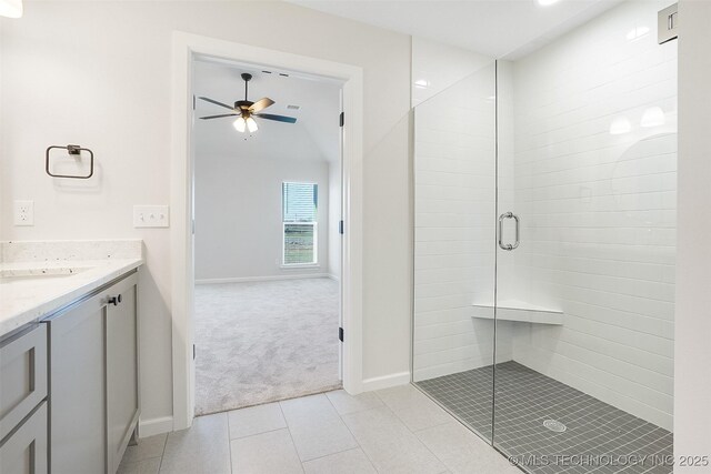 23192 E 106th St S, Broken Arrow, OK 74014 - full bathroom with baseboards, vanity, a ceiling fan, a stall shower, and tile patterned flooring