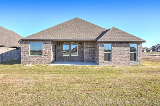 23192 E 106th St S, Broken Arrow, OK 74014 - back of house featuring a shingled roof, a patio, brick siding, and a yard