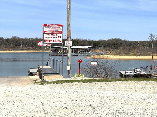 2828 Riverview Rd, Kingston, OK 73439 - dock area featuring a forest view and a water view