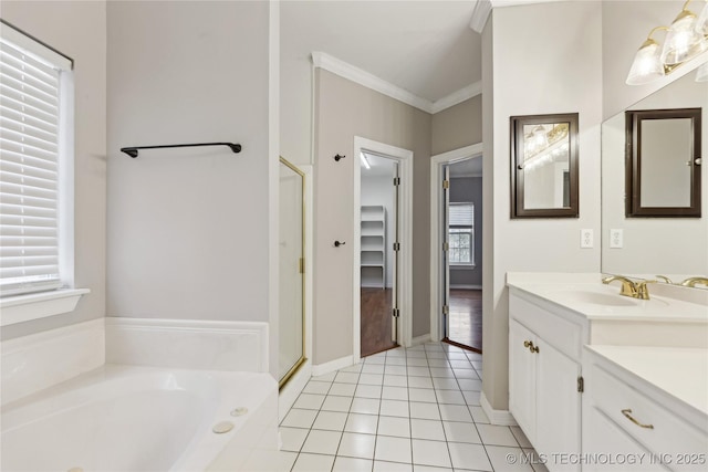 full bath with vanity, tile patterned floors, ornamental molding, a garden tub, and a stall shower