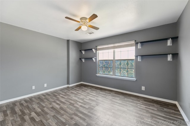 unfurnished room featuring baseboards, a ceiling fan, and wood finished floors