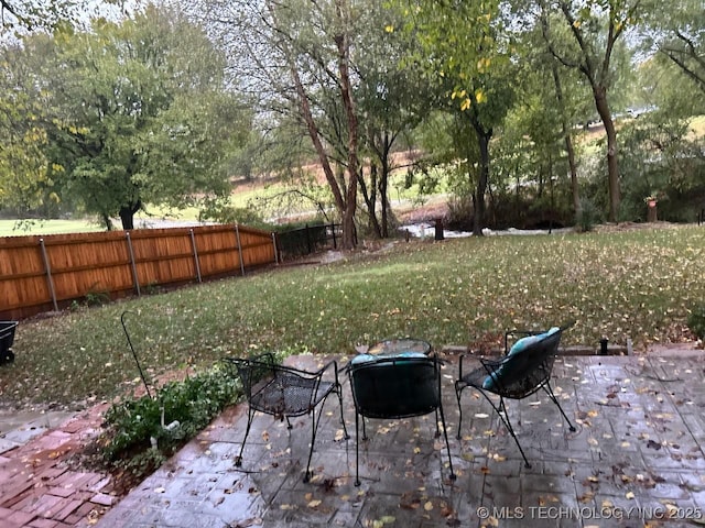 view of yard with a patio and fence