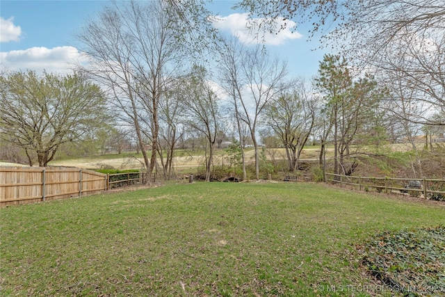 view of yard featuring fence