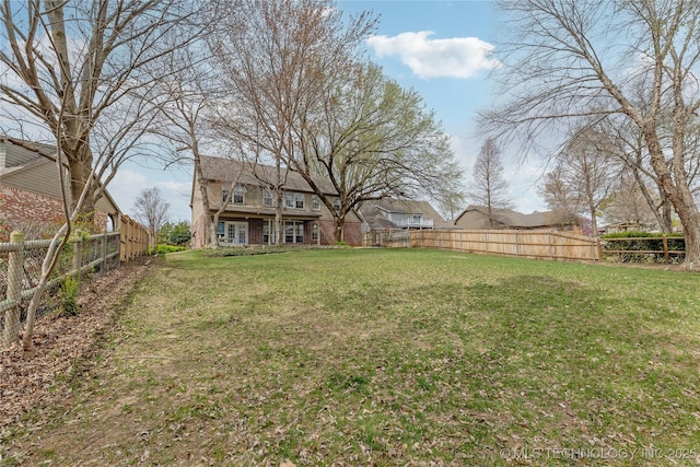 view of yard with a fenced backyard