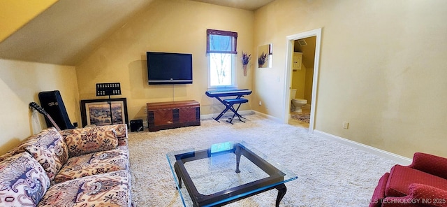 carpeted living area with baseboards and lofted ceiling