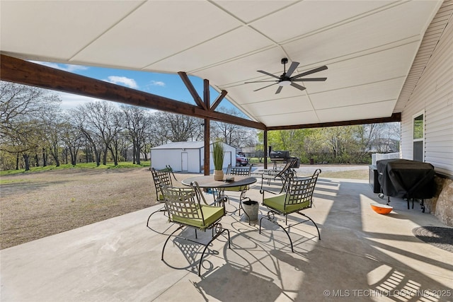 20225 S 4092nd Rd, Claremore, OK 74019 - view of patio featuring grilling area, a ceiling fan, outdoor dining area, and an outdoor structure