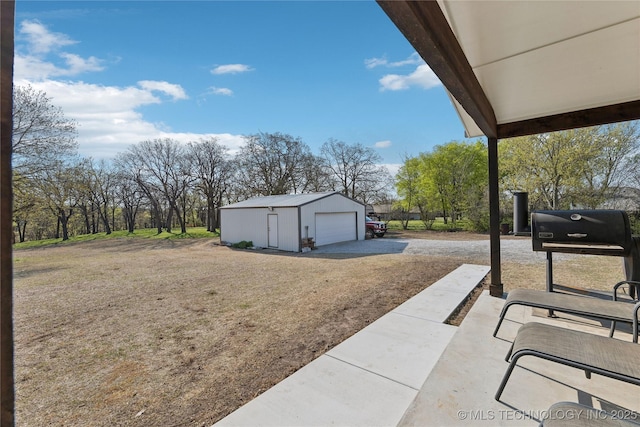 20225 S 4092nd Rd, Claremore, OK 74019 - view of yard featuring a detached garage, an outdoor structure, and driveway