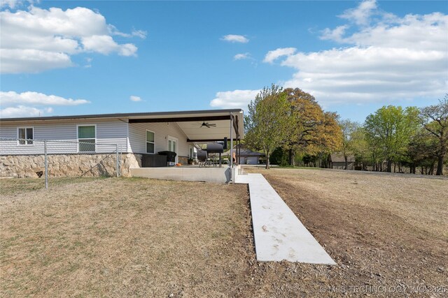 20225 S 4092nd Rd, Claremore, OK 74019 - back of property with a patio area, ceiling fan, and stone siding