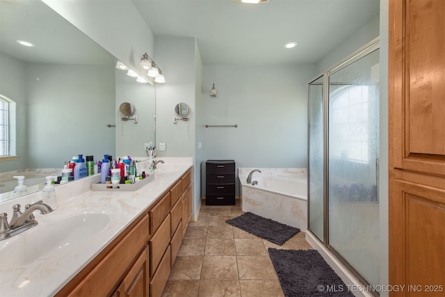 bathroom featuring double vanity, a shower stall, a sink, and a bath