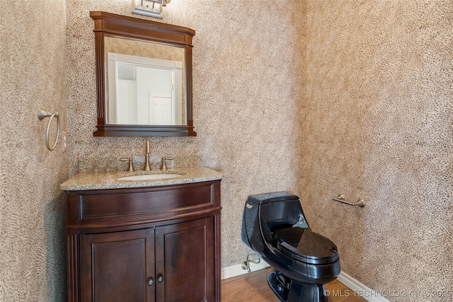 8315 N 99th E Ave, Owasso, OK 74055 - bathroom featuring vanity and wood finished floors