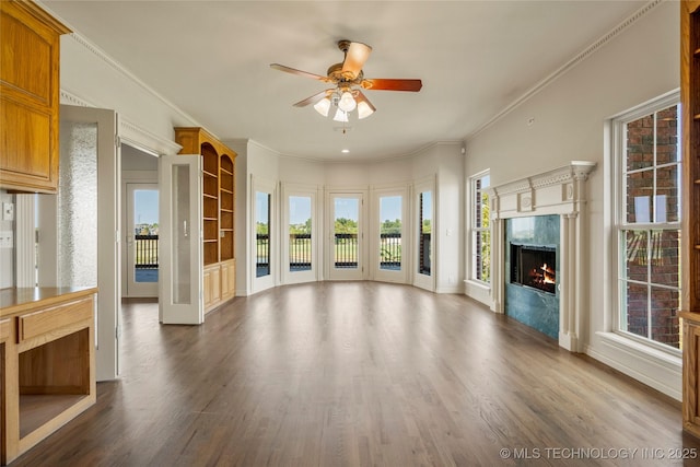 8315 N 99th E Ave, Owasso, OK 74055 - unfurnished living room featuring ceiling fan, a high end fireplace, wood finished floors, and ornamental molding