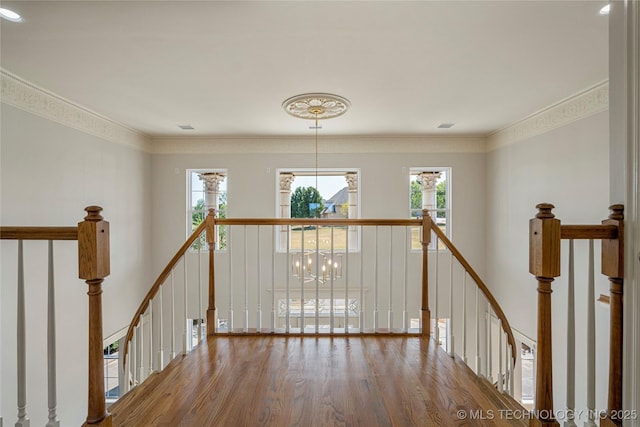 8315 N 99th E Ave, Owasso, OK 74055 - hallway with an upstairs landing, wood finished floors, healthy amount of natural light, and ornamental molding