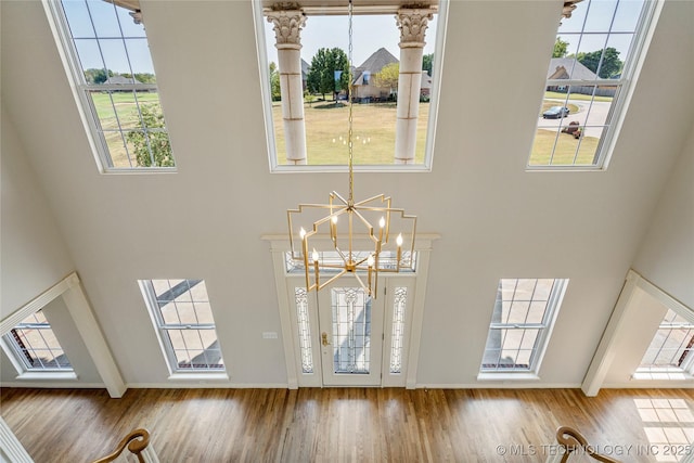 8315 N 99th E Ave, Owasso, OK 74055 - detailed view of wood finished floors and a chandelier