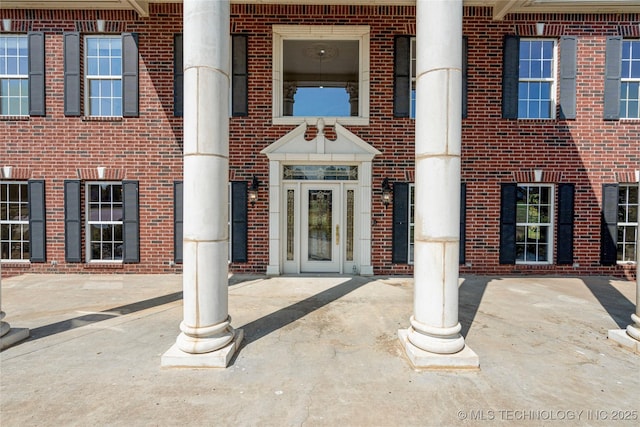 8315 N 99th E Ave, Owasso, OK 74055 - doorway to property featuring brick siding