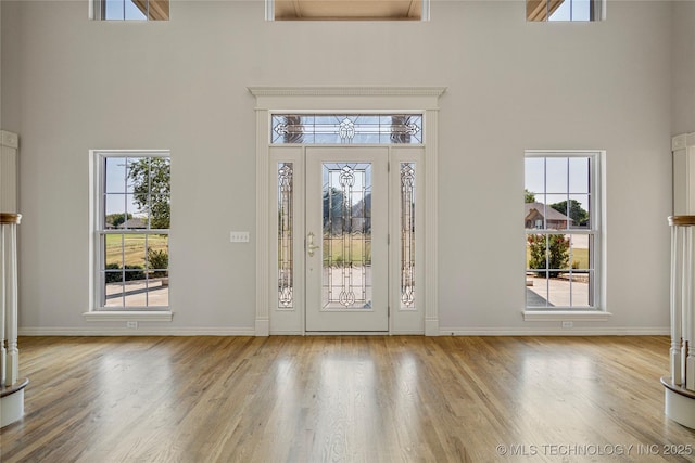 8315 N 99th E Ave, Owasso, OK 74055 - foyer entrance with a high ceiling and wood finished floors