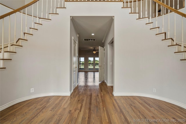 8315 N 99th E Ave, Owasso, OK 74055 - foyer with wood finished floors, stairway, and ceiling fan