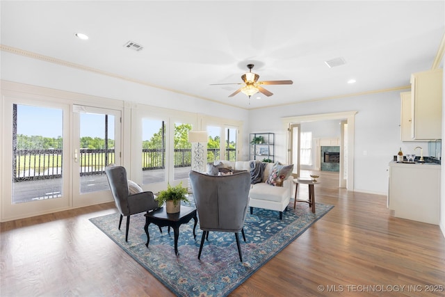 8315 N 99th E Ave, Owasso, OK 74055 - dining space featuring ornamental molding, wood finished floors, a ceiling fan, french doors, and recessed lighting