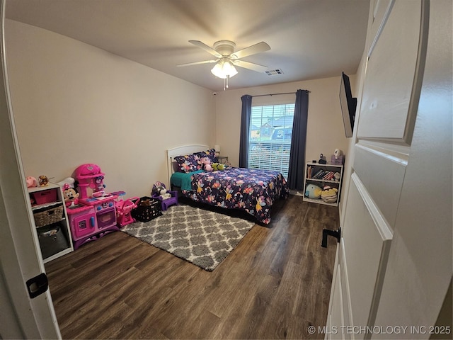 bedroom with wood finished floors and ceiling fan