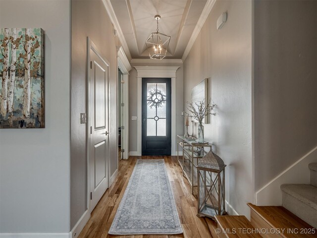 5519 E 123rd St S, Bixby, OK 74008 - entrance foyer featuring a chandelier, wood finished floors, crown molding, stairway, and baseboards