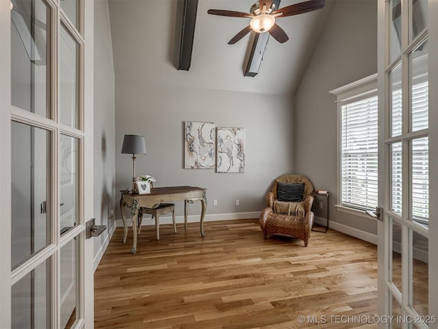 sitting room with vaulted ceiling, light wood-type flooring, french doors, baseboards, and a ceiling fan