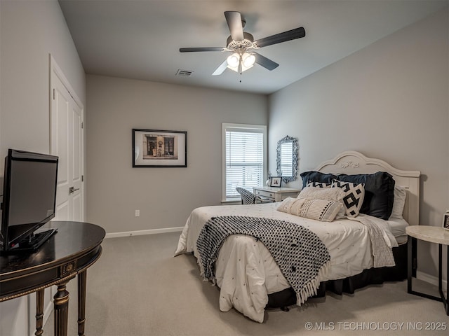 bedroom featuring baseboards, visible vents, carpet flooring, and a ceiling fan