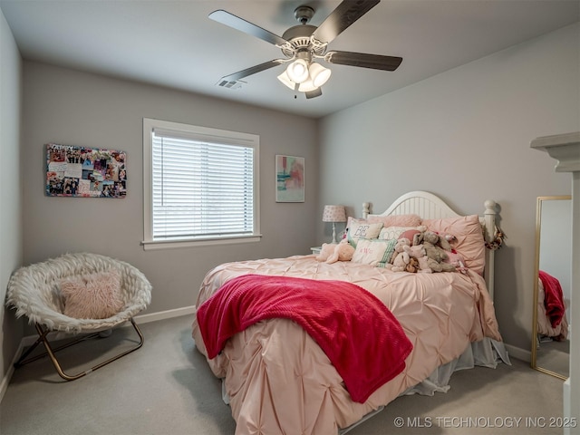 carpeted bedroom with baseboards, visible vents, and ceiling fan