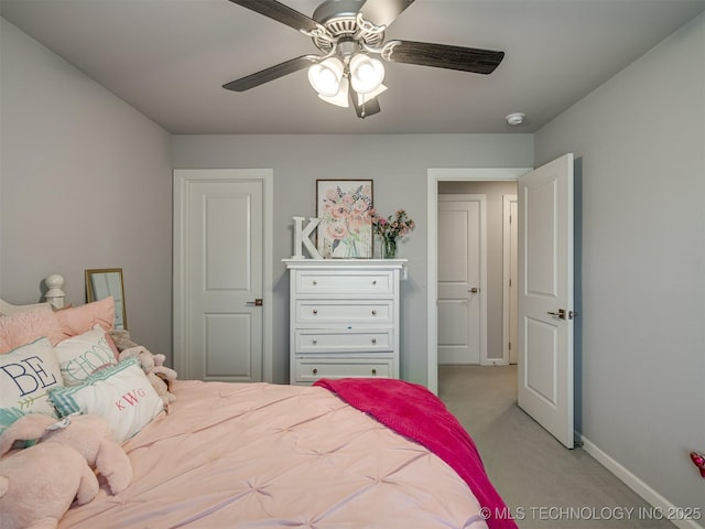bedroom featuring light carpet, baseboards, and ceiling fan