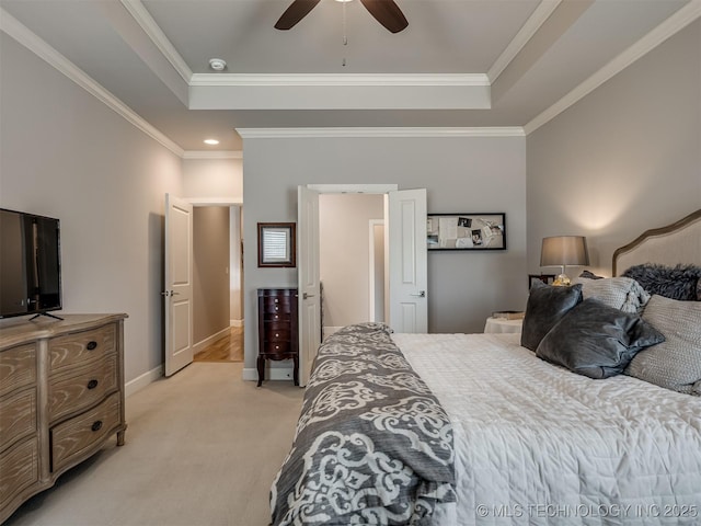 bedroom featuring light colored carpet, baseboards, ornamental molding, and a raised ceiling