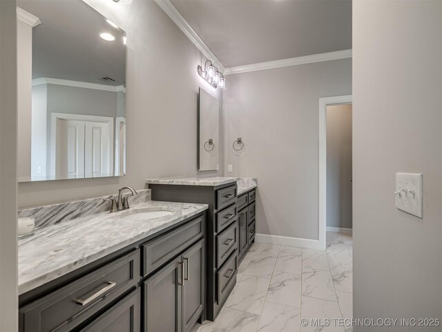 bathroom featuring baseboards, marble finish floor, ornamental molding, two vanities, and a sink