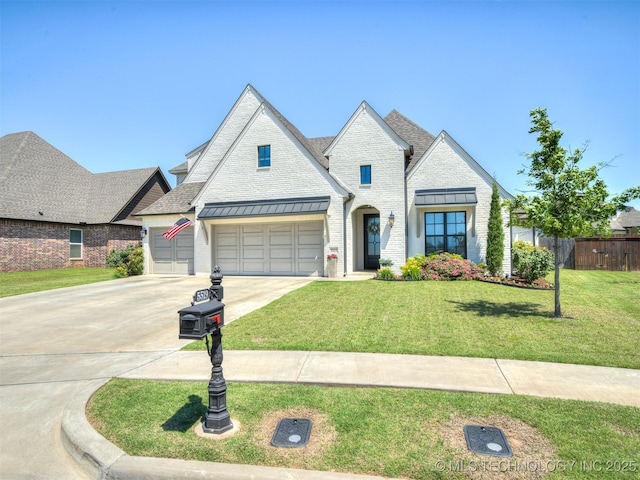5519 E 123rd St S, Bixby, OK 74008 - french country style house featuring driveway, a standing seam roof, roof with shingles, and an attached garage