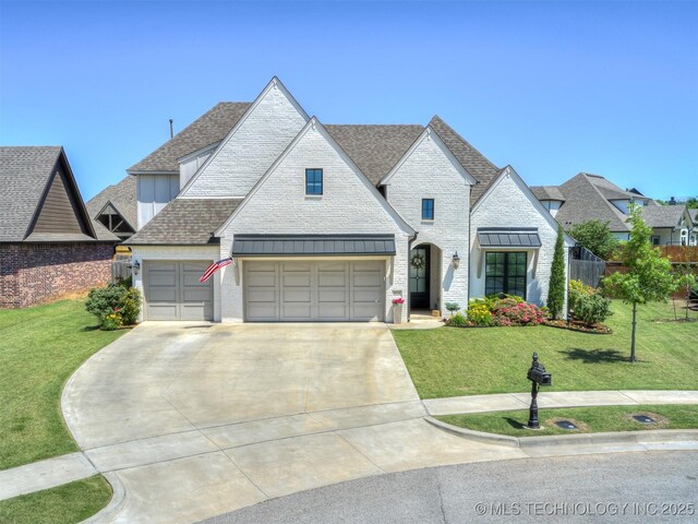 5519 E 123rd St S, Bixby, OK 74008 - french country style house with concrete driveway, roof with shingles, a front lawn, and board and batten siding
