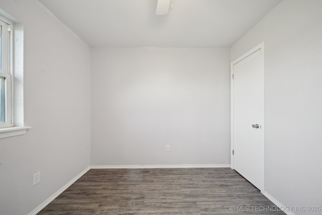 empty room with baseboards, ceiling fan, and wood finished floors