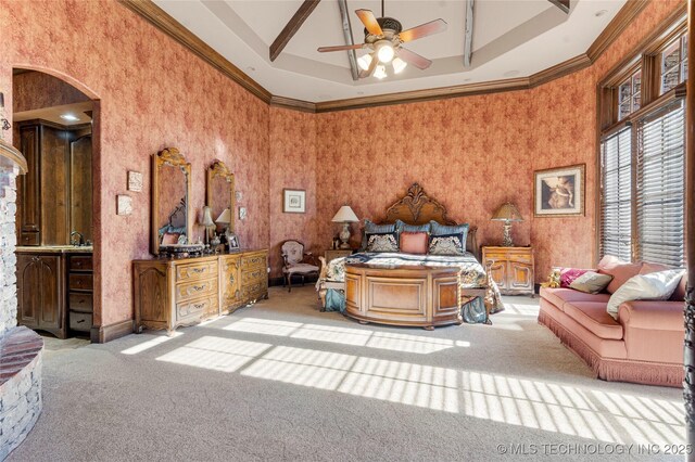 carpeted bedroom featuring arched walkways and ornamental molding