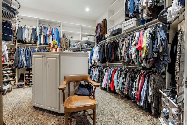 walk in closet with carpet