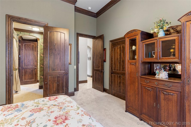 bedroom with a towering ceiling, baseboards, light colored carpet, and crown molding
