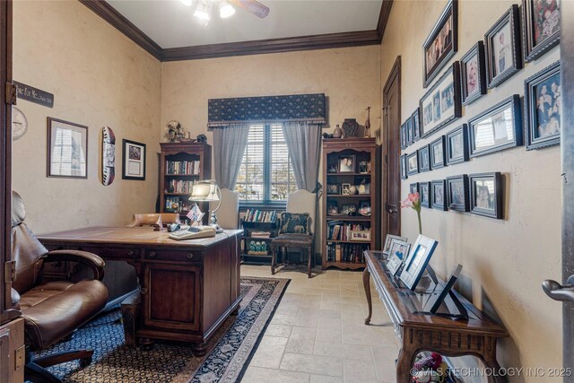 office featuring ceiling fan, stone tile flooring, and crown molding