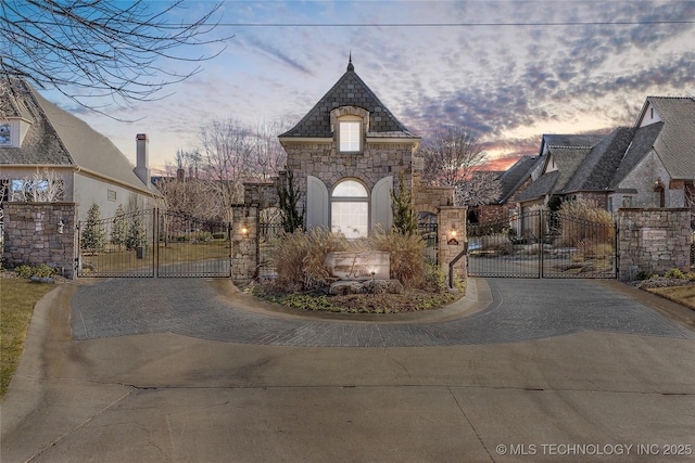 exterior space featuring a gate and driveway