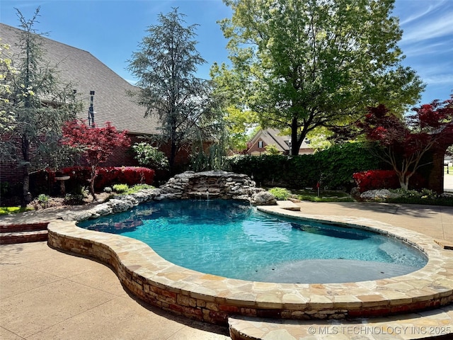 pool featuring a patio area