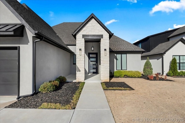 12202 S 102 E Ave, Bixby, OK 74008 - exterior space featuring stone siding, stucco siding, and roof with shingles