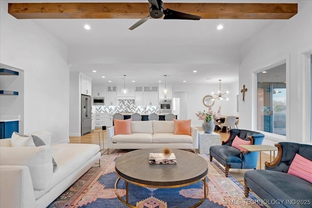 12202 S 102 E Ave, Bixby, OK 74008 - living room featuring light wood-type flooring, ceiling fan with notable chandelier, beamed ceiling, and recessed lighting