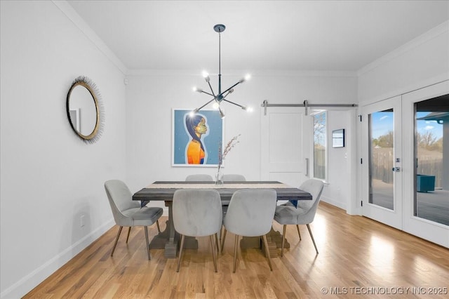 12202 S 102 E Ave, Bixby, OK 74008 - dining room with crown molding, french doors, wood finished floors, baseboards, and an inviting chandelier