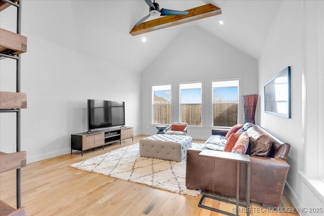 12202 S 102 E Ave, Bixby, OK 74008 - living area with high vaulted ceiling, baseboards, ceiling fan, wood finished floors, and beam ceiling