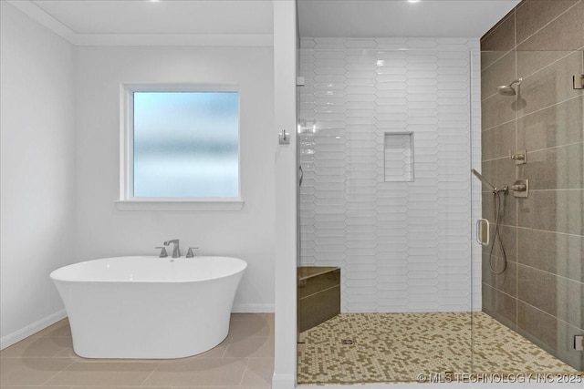 12202 S 102 E Ave, Bixby, OK 74008 - bathroom featuring baseboards, a soaking tub, tile patterned flooring, and a shower stall