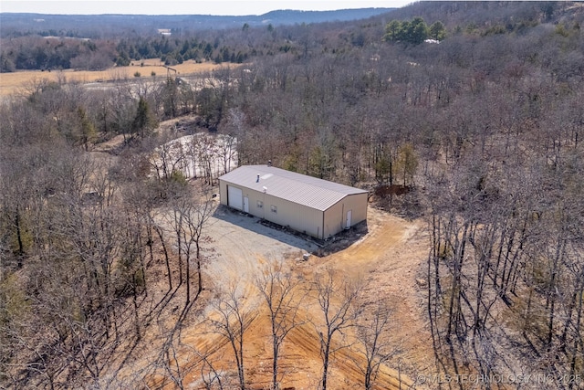aerial view featuring a view of trees